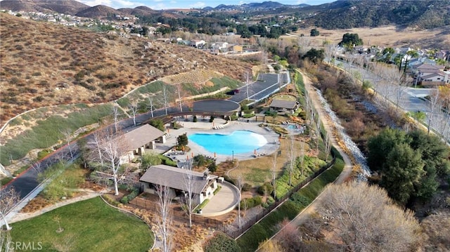 birds eye view of property featuring a mountain view