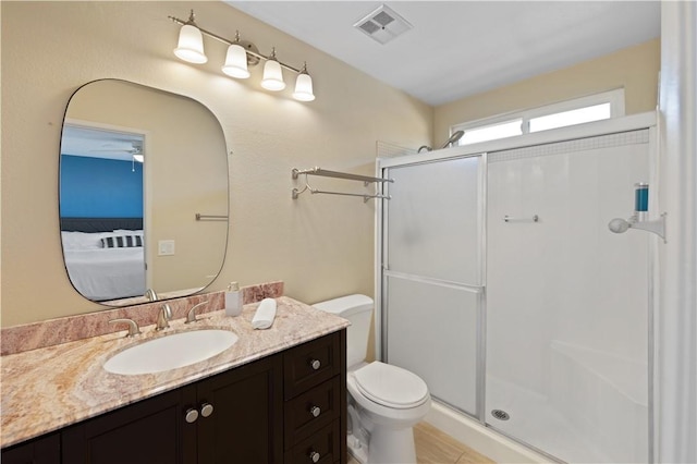 bathroom with vanity, toilet, and an enclosed shower