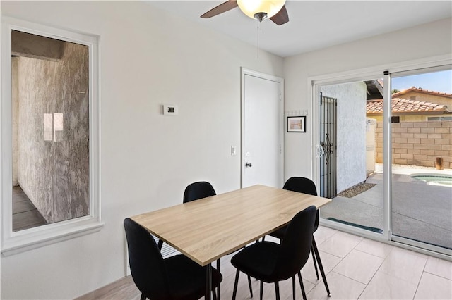 dining room featuring ceiling fan and light tile patterned flooring