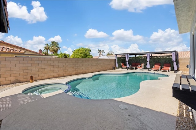 view of swimming pool featuring a patio and an in ground hot tub