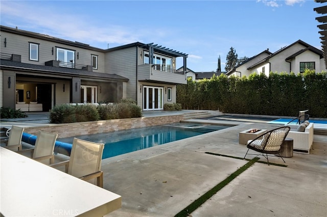 view of pool featuring a patio and french doors