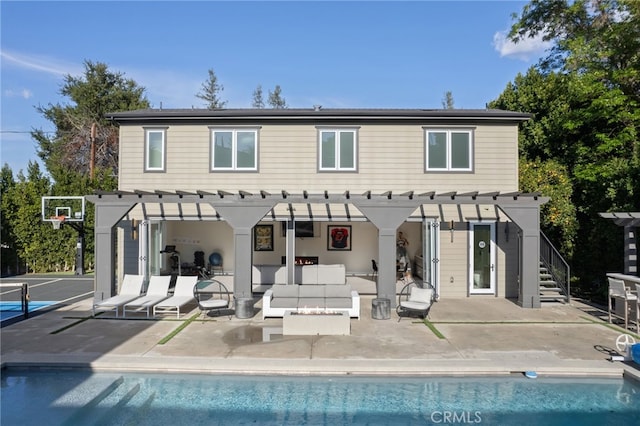 back of property with a pergola, a patio area, and outdoor lounge area