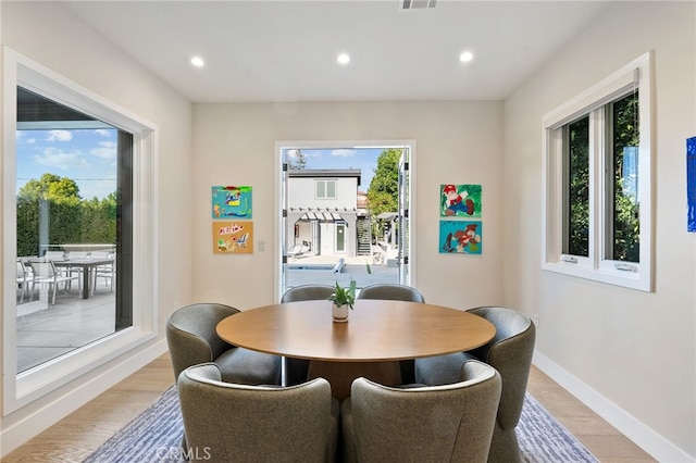 dining area with light wood-type flooring