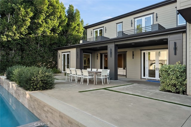 back of house with french doors and a patio area