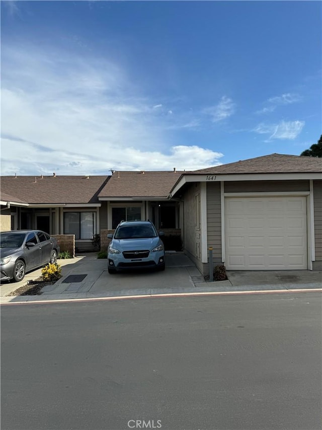 single story home with a garage