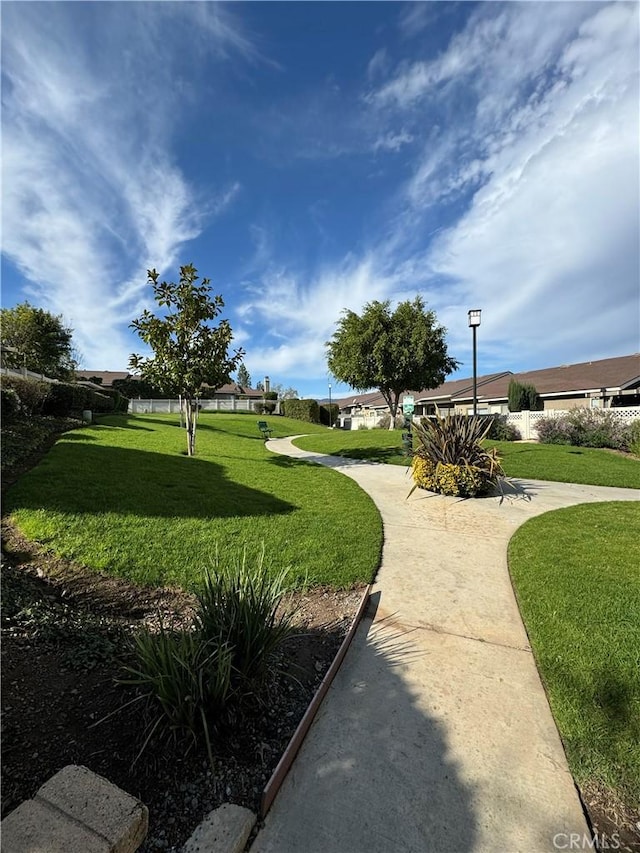 view of home's community featuring a yard