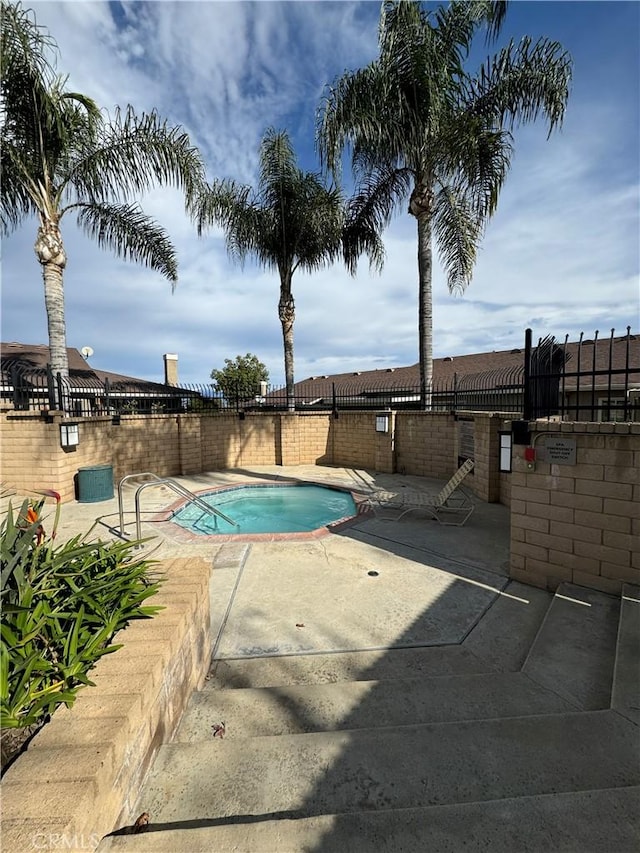 view of swimming pool with a patio