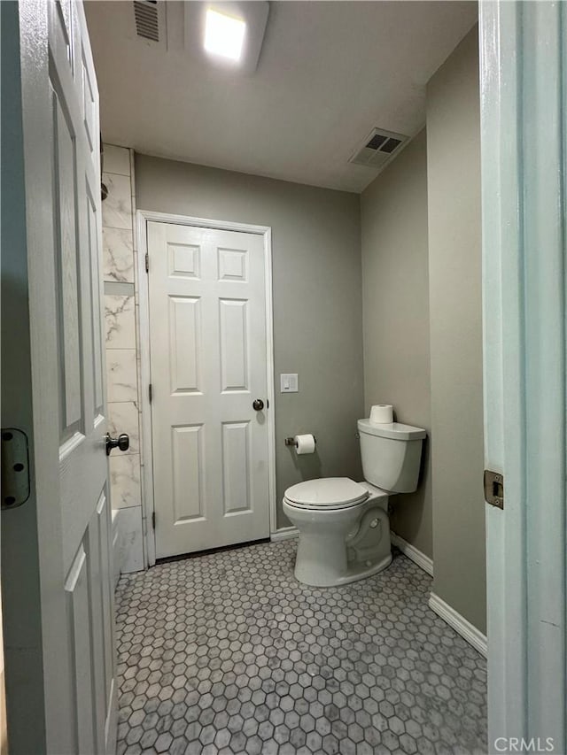 bathroom featuring toilet