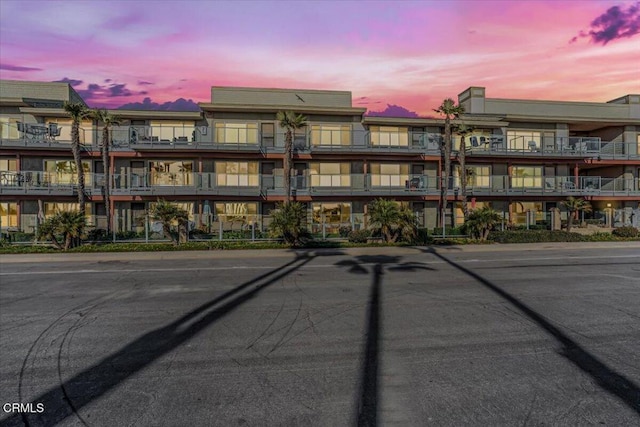 view of outdoor building at dusk