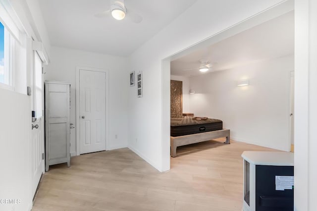 hallway with light hardwood / wood-style flooring