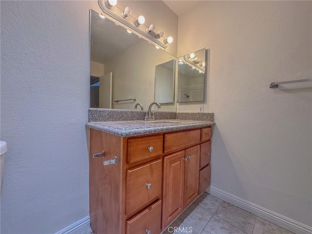 bathroom with vanity and tile patterned flooring