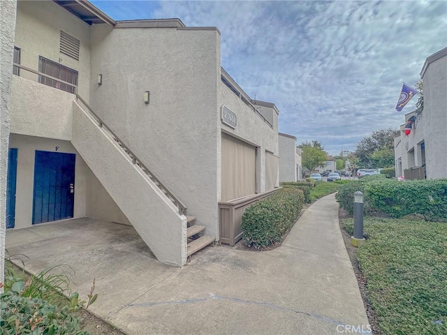 view of side of property featuring a garage