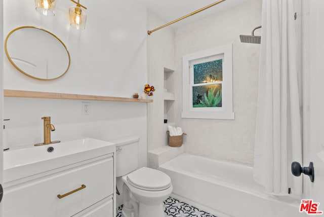 full bathroom with vanity, shower / tub combo with curtain, and toilet