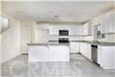 kitchen with white cabinetry and a center island