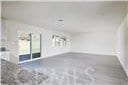 empty room with concrete flooring