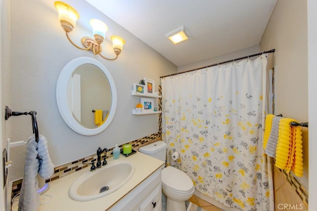 bathroom featuring walk in shower, vanity, and toilet