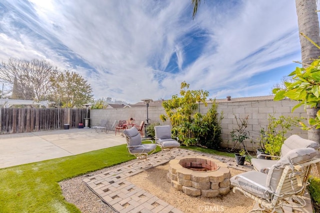 view of patio / terrace with an outdoor fire pit