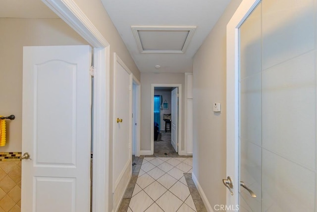 corridor featuring light tile patterned flooring