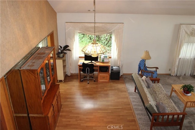 home office with wood-type flooring