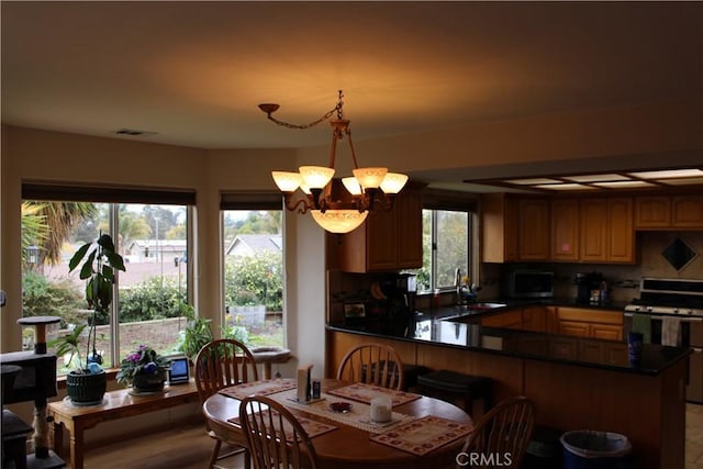 interior space with sink and a notable chandelier