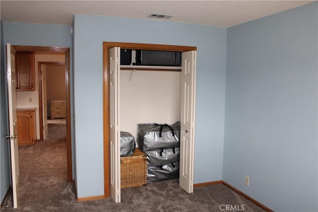 carpeted bedroom with a closet