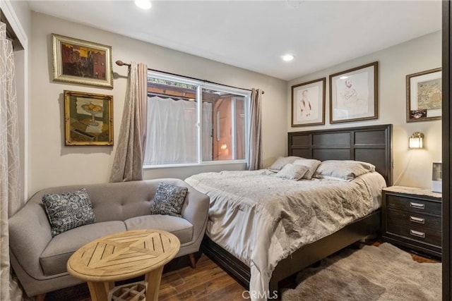 bedroom with hardwood / wood-style flooring