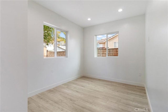 unfurnished room featuring light wood-type flooring