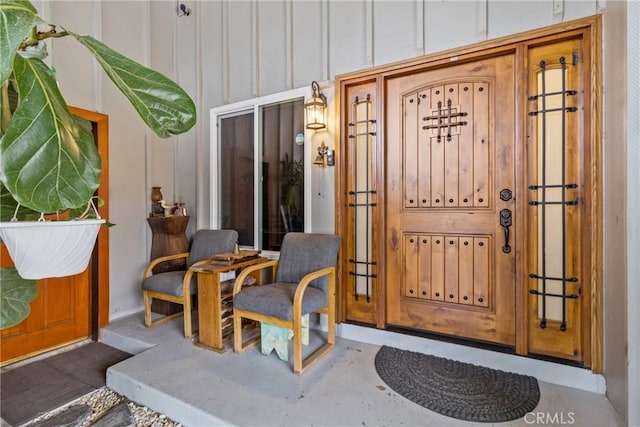 entrance to property featuring board and batten siding