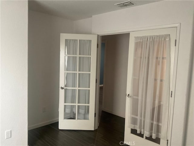 empty room featuring dark hardwood / wood-style floors