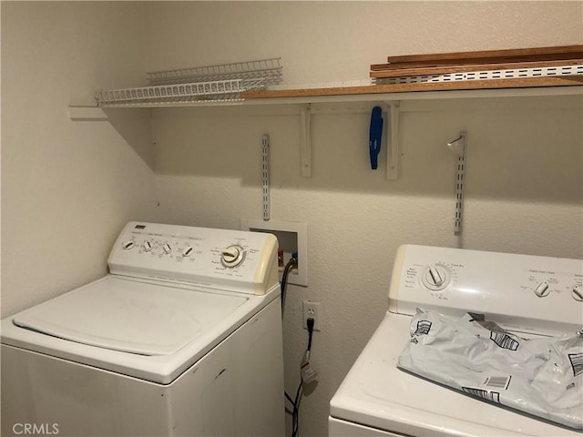 laundry room featuring washing machine and dryer