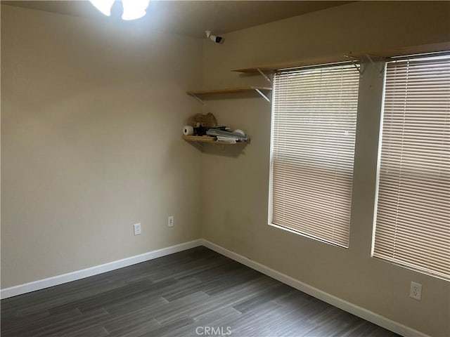 spare room featuring dark hardwood / wood-style flooring