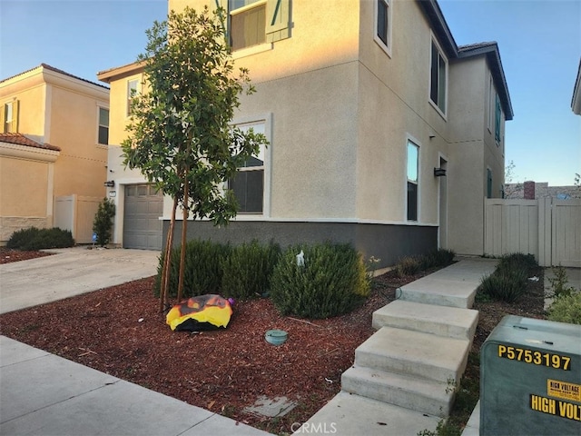 view of side of home with a garage