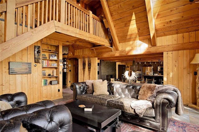 living room with wood ceiling, high vaulted ceiling, beamed ceiling, and wood walls