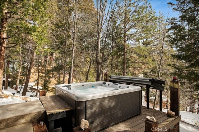 deck featuring a hot tub