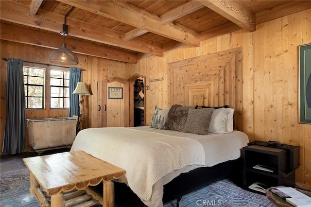 bedroom with wood ceiling, beam ceiling, and wooden walls