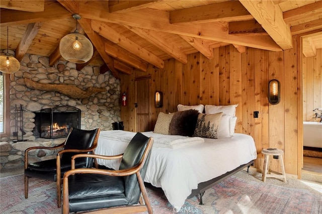 bedroom featuring wood ceiling, a stone fireplace, wooden walls, and vaulted ceiling with beams