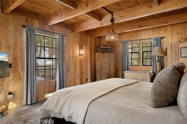 bedroom featuring beamed ceiling, wooden ceiling, and wooden walls