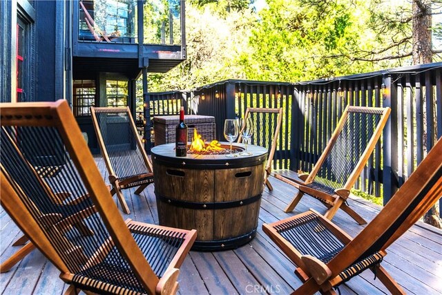 deck featuring a fire pit