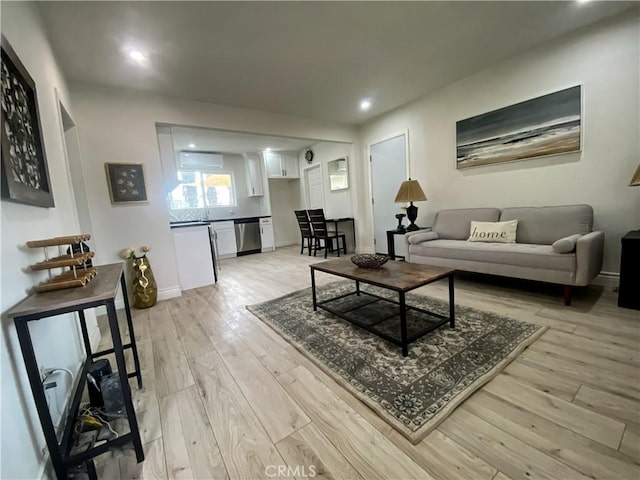 living room with light hardwood / wood-style flooring