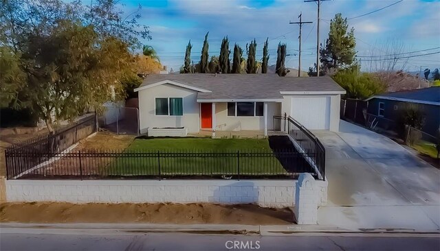 single story home with a garage and a front lawn