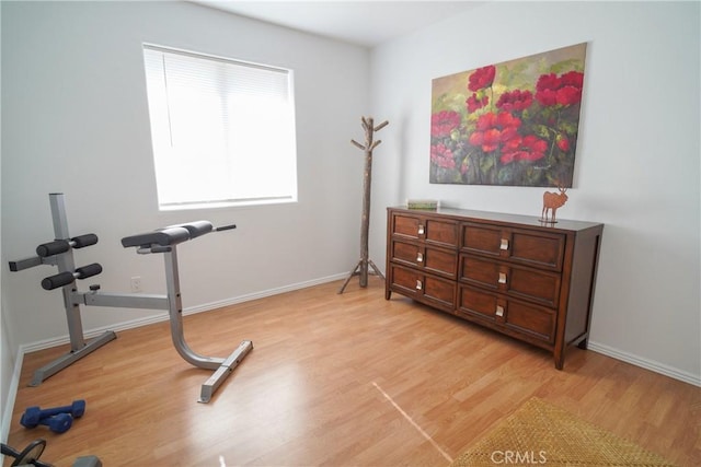 workout room with light wood-type flooring