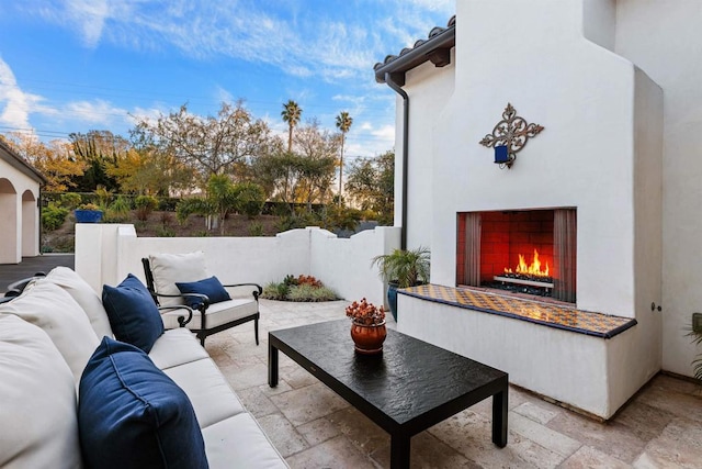 view of patio / terrace featuring an outdoor living space with a fireplace