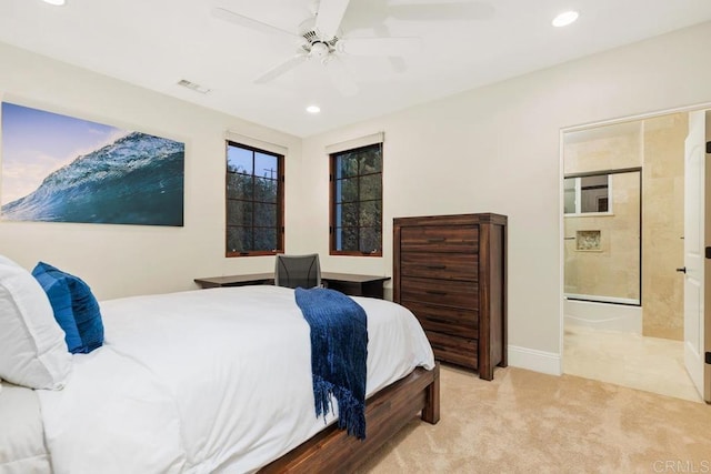 carpeted bedroom featuring connected bathroom and ceiling fan