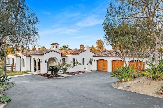 mediterranean / spanish-style house featuring a garage