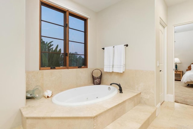 bathroom with tiled bath and tile patterned floors