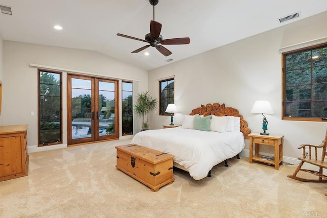 bedroom featuring ceiling fan, light colored carpet, vaulted ceiling, and french doors