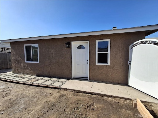 property entrance with a patio area