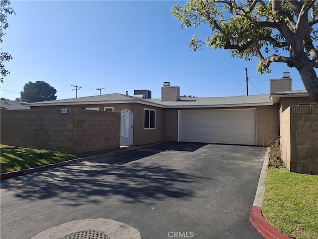 single story home featuring a garage