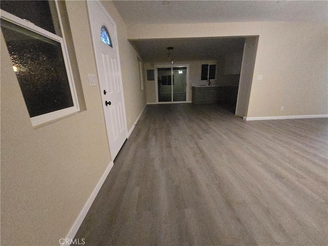 unfurnished living room featuring hardwood / wood-style flooring