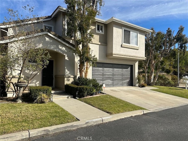 view of front of house with a garage and a front yard